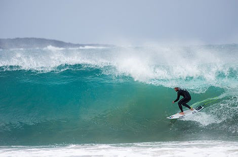 Mick Fanning rides a wave