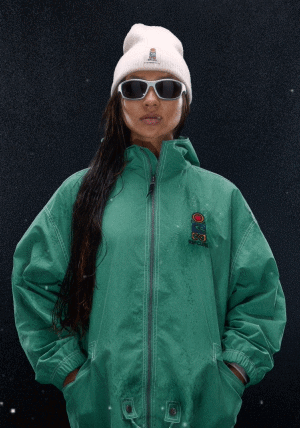 Woman in green jacket shot on black background