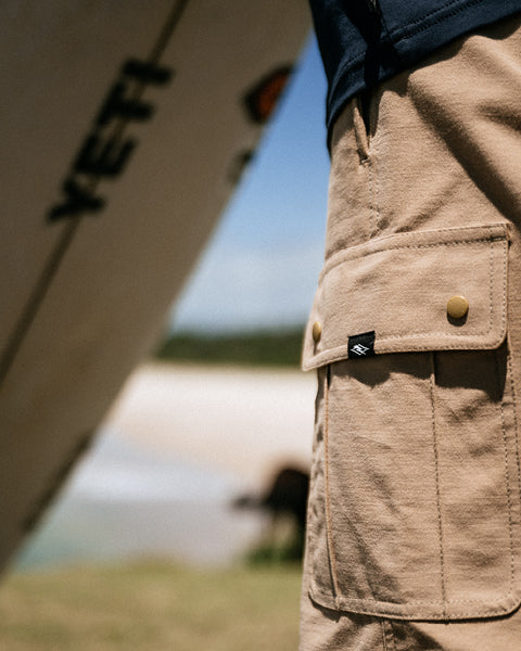 Person wearing beige shorts