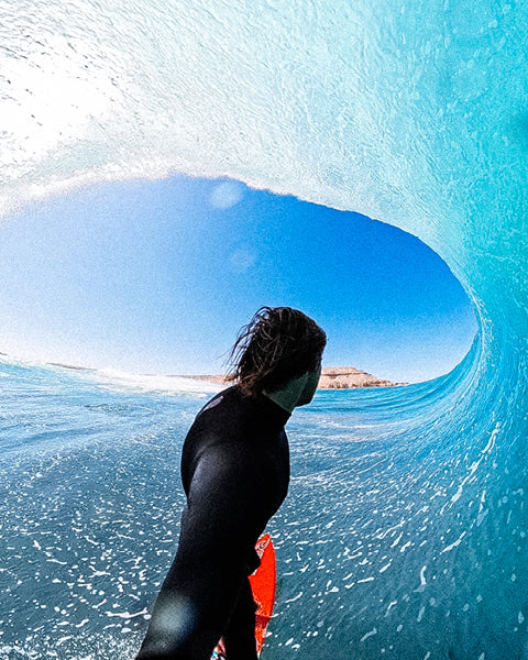 Kipp Caddy surfing in a barrel