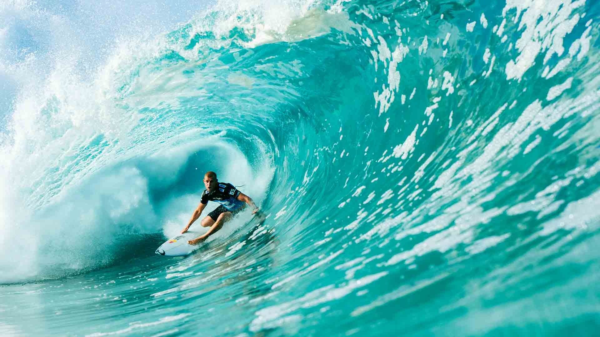Surfer riding a large wave in the ocean