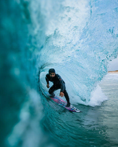 Person surfing inside a large ice formation
