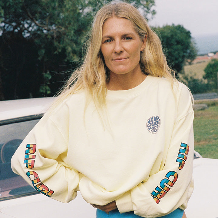 Stephanie Gilmore wearing yellow Rip Curl jumper