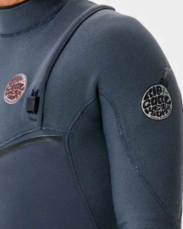 Close-up of a blue wetsuit with brand logos on the shoulder and sleeve.