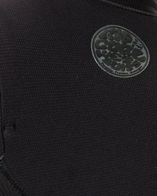 Close-up of a black fabric surface with a logo in the center.